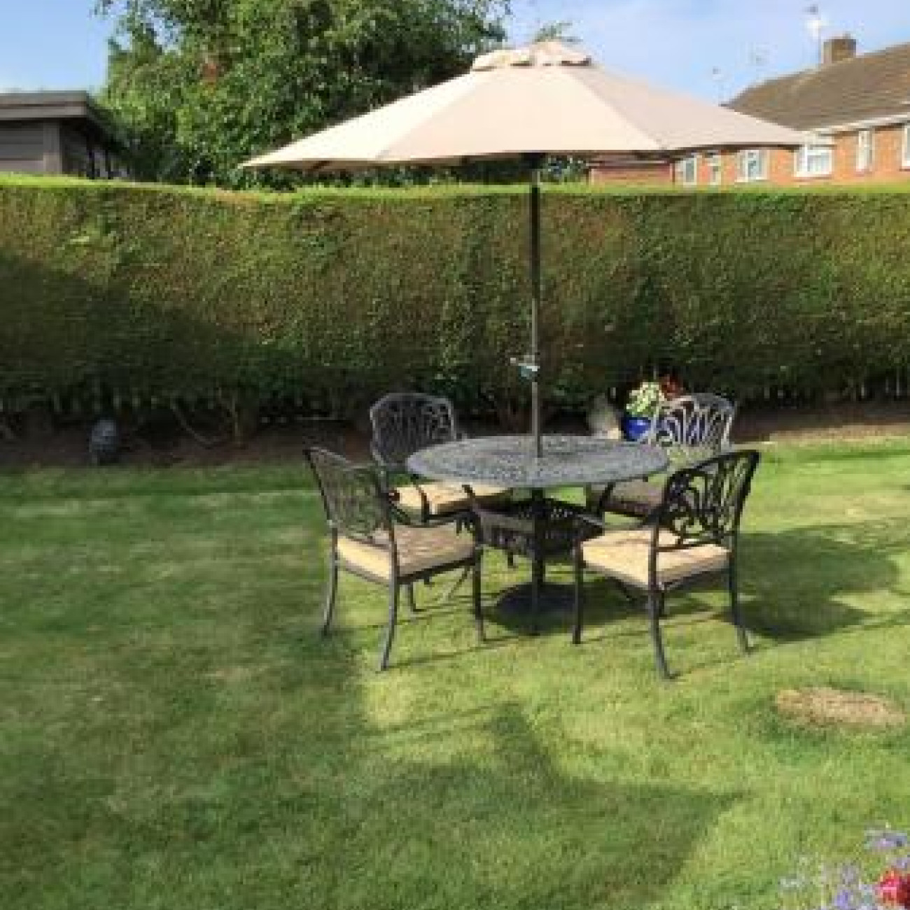 Garden table, chairs and parasol