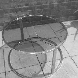 A Circular metal and glass coffee table