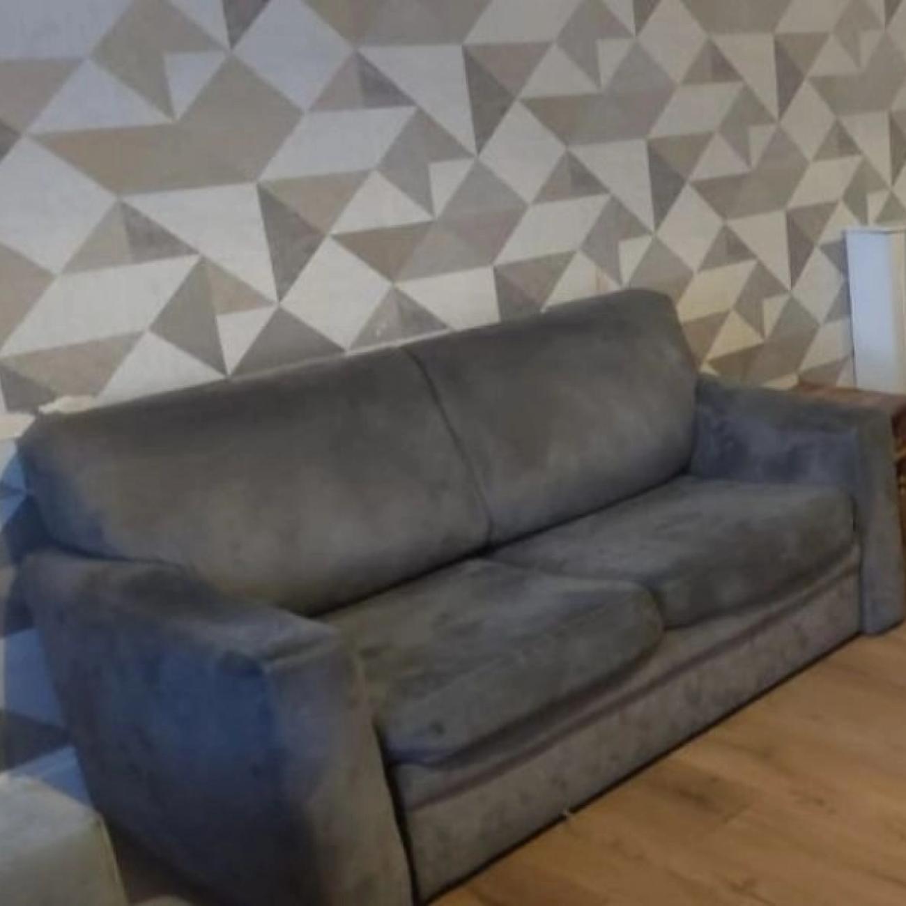 2 seater Grey color sofa-bed.