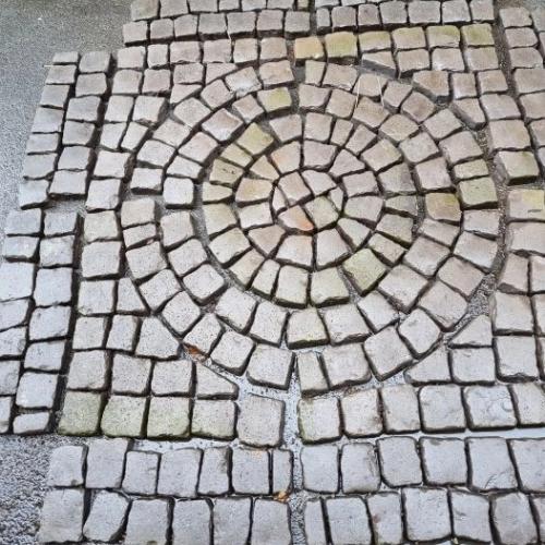 Gray Stone Setts. Circle within a square.