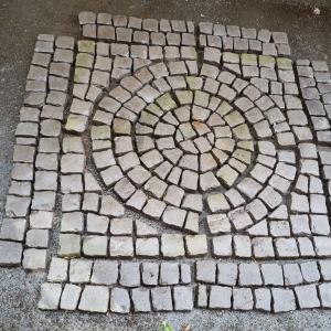 Gray Stone Setts. Circle within a square.