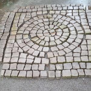 Gray Stone Setts. Circle within a square.